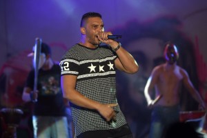 Tunisian hip-hop singer Balti  performs on stage during the 51st  session of the Carthage International Festival on August 16, 2015 at the Roman theatre in Carthage, a seaside suburb of the Tunisian capital. AFP PHOTO / FETHI BELAID (Photo by FETHI BELAID / AFP) (Photo by FETHI BELAID/AFP via Getty Images)